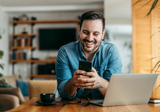 Man using his mobile phone to contact Old Mutual